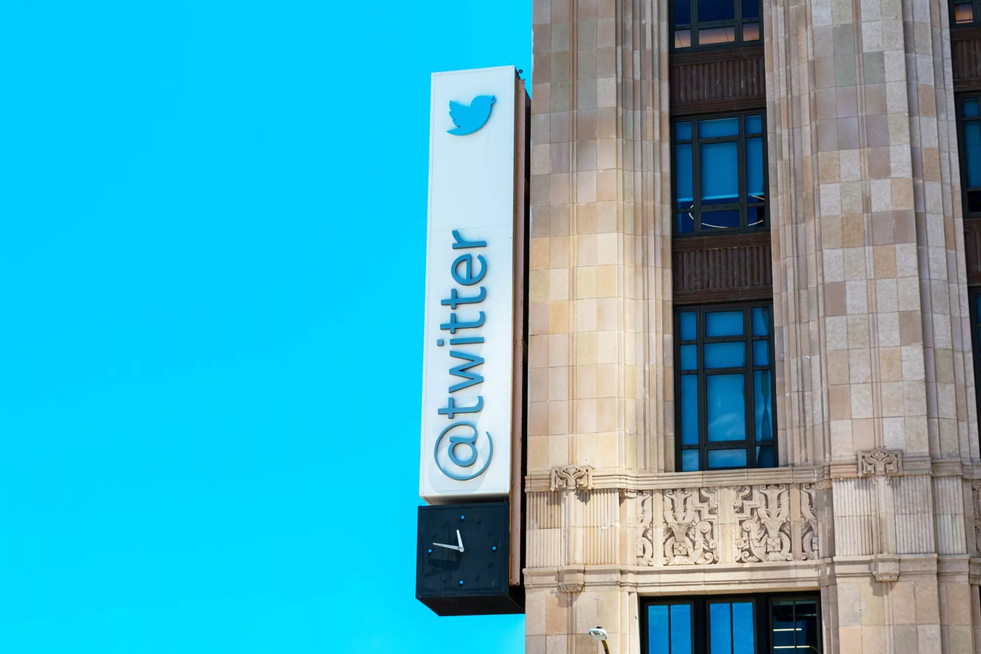 Twitter sign and logo on facade of global headquarters building at 1355 Market Street