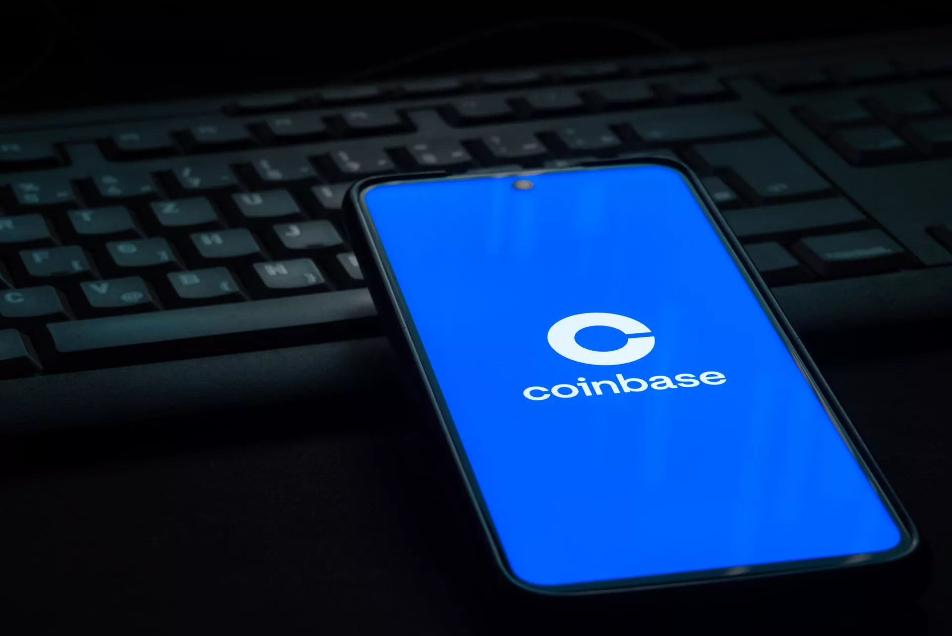 Coinbase cryptocurrency exchange logo on smartphone screen